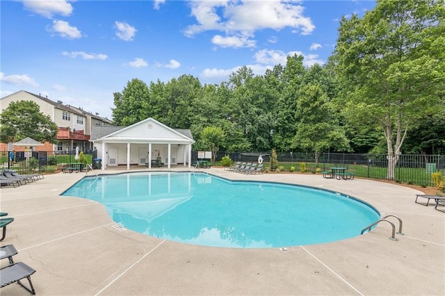 1049 Prestwyck Ct, Alpharetta, GA 30004 - community pool featuring a patio and view of wooded area