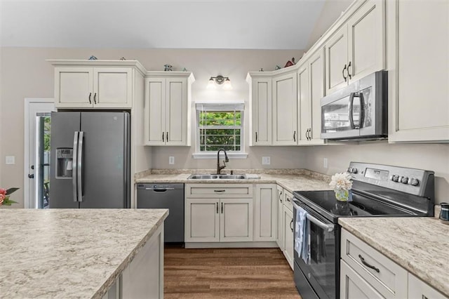417 Beamer Rd SW, Calhoun, GA 30701 - kitchen with stainless steel appliances, a sink, light countertops, dark wood-style flooring, and white cabinets
