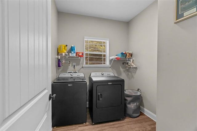 417 Beamer Rd SW, Calhoun, GA 30701 - laundry room with washer and dryer, wood finished floors, and baseboards
