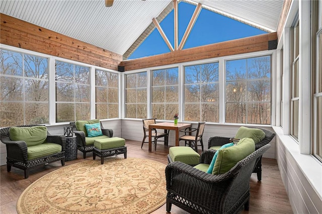 sunroom featuring vaulted ceiling