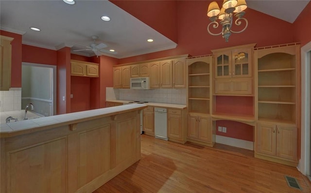 2121 Brittany Ct, Gainesville, GA 30506 - kitchen featuring white microwave, light wood finished floors, a ceiling fan, backsplash, and recessed lighting