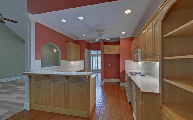 2121 Brittany Ct, Gainesville, GA 30506 - kitchen featuring ceiling fan, tile counters, a peninsula, recessed lighting, and a breakfast bar area