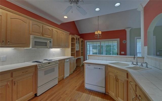 2121 Brittany Ct, Gainesville, GA 30506 - kitchen with white appliances, tile counters, a sink, lofted ceiling, and decorative backsplash