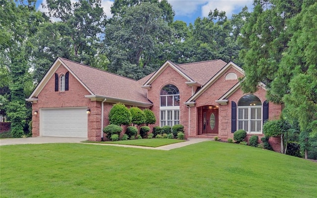 2121 Brittany Ct, Gainesville, GA 30506 - view of front of home with brick siding, a front lawn, driveway, and an attached garage