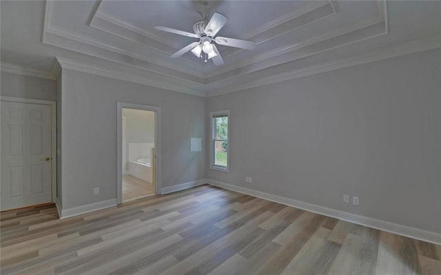 2121 Brittany Ct, Gainesville, GA 30506 - unfurnished bedroom featuring a raised ceiling, wood finished floors, ensuite bathroom, baseboards, and crown molding