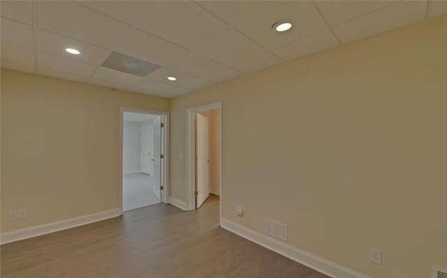 2121 Brittany Ct, Gainesville, GA 30506 - spare room featuring wood finished floors, baseboards, a drop ceiling, and recessed lighting
