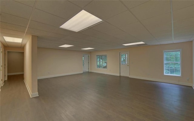 2121 Brittany Ct, Gainesville, GA 30506 - empty room featuring dark wood-type flooring, baseboards, a drop ceiling, and plenty of natural light