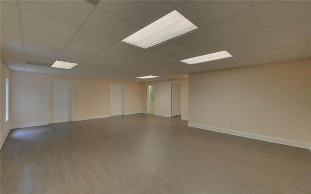 2121 Brittany Ct, Gainesville, GA 30506 - spare room with wood finished floors, a drop ceiling, and baseboards
