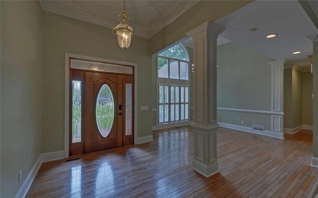 2121 Brittany Ct, Gainesville, GA 30506 - entrance foyer with ornate columns, wood-type flooring, and baseboards
