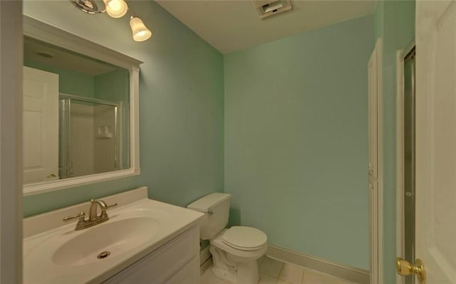 2121 Brittany Ct, Gainesville, GA 30506 - bathroom featuring vanity, tile patterned flooring, a shower with door, toilet, and baseboards