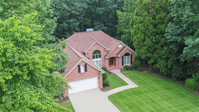 2121 Brittany Ct, Gainesville, GA 30506 - view of front of house featuring driveway, brick siding, a front lawn, and a chimney