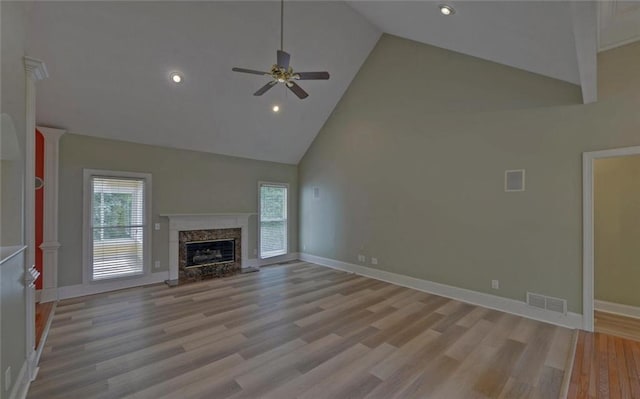 2121 Brittany Ct, Gainesville, GA 30506 - unfurnished living room featuring high vaulted ceiling, a ceiling fan, light wood-style flooring, a high end fireplace, and recessed lighting