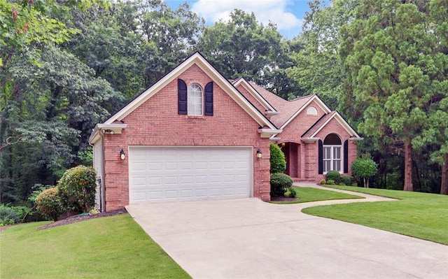 2121 Brittany Ct, Gainesville, GA 30506 - traditional-style house with concrete driveway, brick siding, a front lawn, and an attached garage