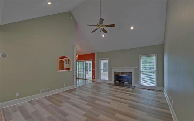 2121 Brittany Ct, Gainesville, GA 30506 - unfurnished living room featuring high vaulted ceiling, ceiling fan, healthy amount of natural light, a premium fireplace, and baseboards