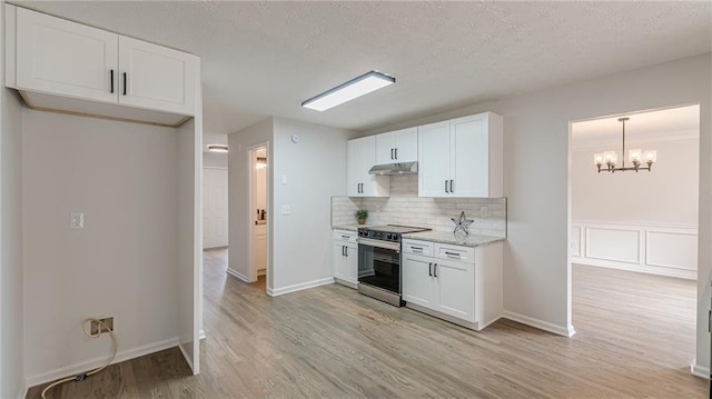 kitchen with light wood-style floors, white cabinetry, and electric range