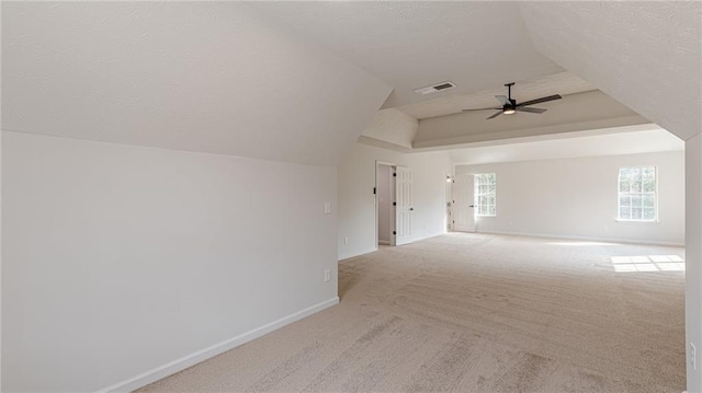 additional living space with visible vents, carpet flooring, ceiling fan, a textured ceiling, and baseboards