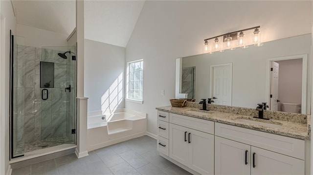 bathroom featuring a stall shower, a sink, and lofted ceiling