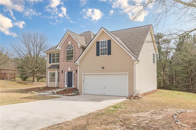 traditional home with brick siding, roof with shingles, concrete driveway, an attached garage, and a front yard