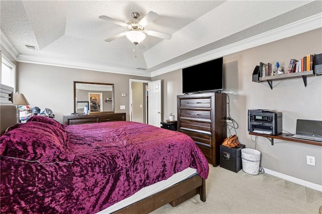 carpeted bedroom featuring a tray ceiling, ceiling fan, crown molding, and a textured ceiling