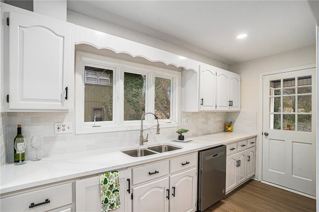 kitchen with white cabinetry, dishwasher, sink, and dark hardwood / wood-style flooring