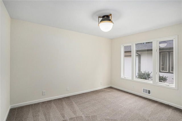 view of carpeted spare room