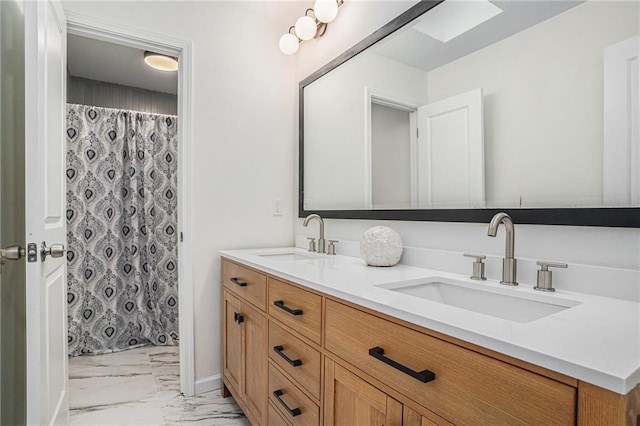 bathroom featuring vanity and a shower with shower curtain