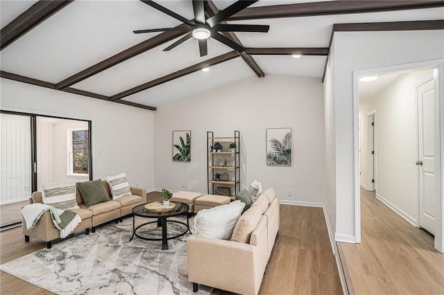 living room with vaulted ceiling with beams, light hardwood / wood-style floors, and ceiling fan