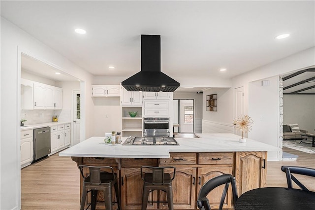 kitchen with white cabinetry, island range hood, light hardwood / wood-style floors, and appliances with stainless steel finishes