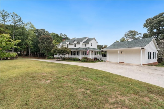 country-style home with a porch, a front yard, and a garage