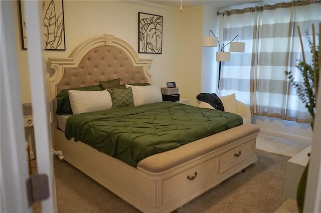 bedroom featuring light carpet