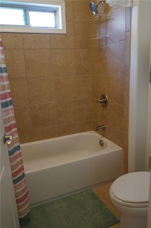 full bath featuring toilet and shower / bathtub combination with curtain