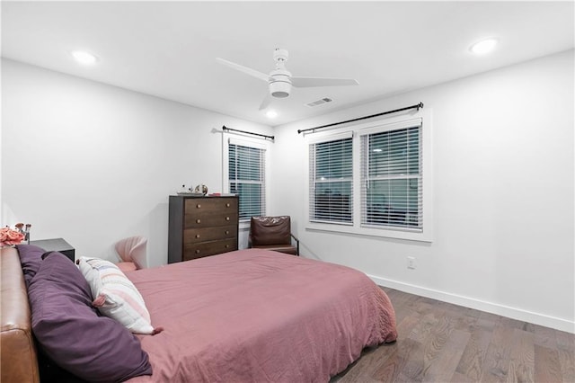 bedroom with ceiling fan and hardwood / wood-style floors