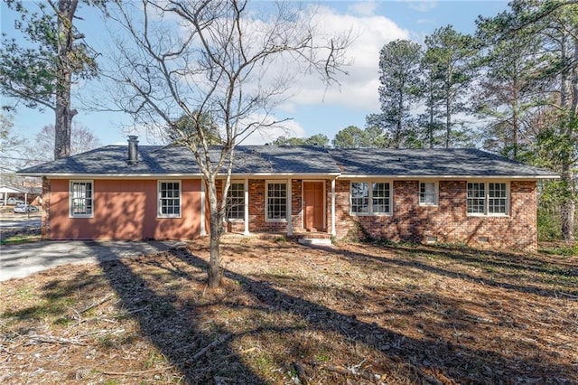 single story home with crawl space and brick siding