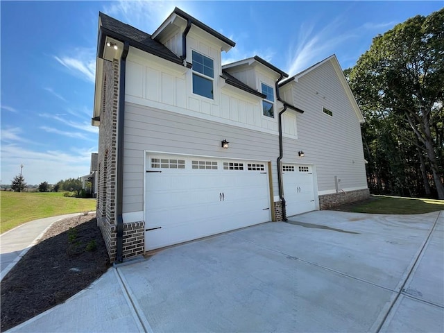 view of side of property featuring a garage