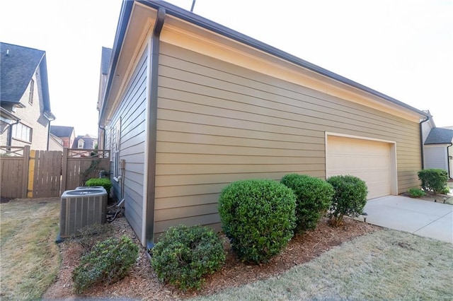 184 Cadence Trl, Canton, GA 30115 - view of property exterior with central AC unit, a garage, and concrete driveway