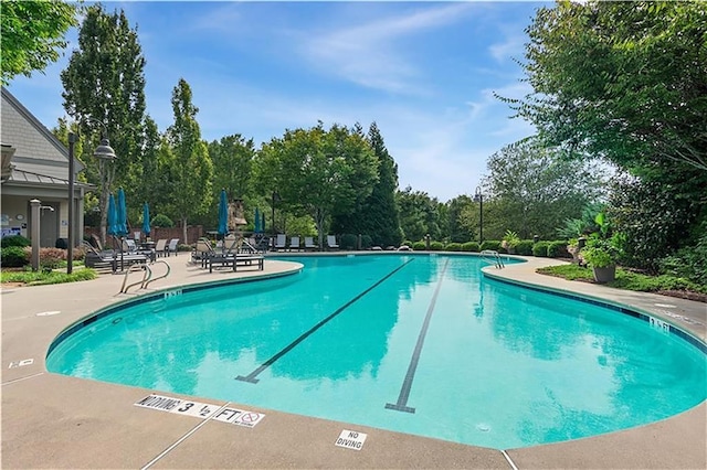 184 Cadence Trl, Canton, GA 30115 - community pool with a patio area