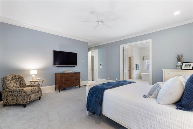 carpeted bedroom featuring a ceiling fan, ensuite bathroom, baseboards, and ornamental molding