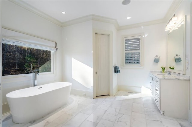 full bathroom featuring vanity, a soaking tub, recessed lighting, ornamental molding, and marble finish floor