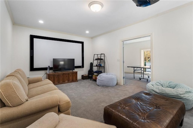 carpeted cinema room with crown molding and recessed lighting