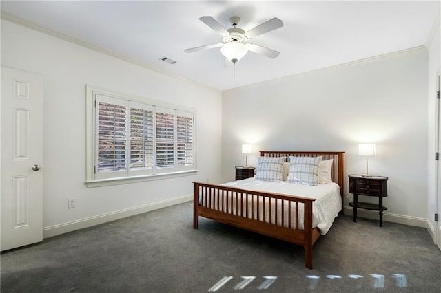 carpeted bedroom featuring visible vents, ceiling fan, crown molding, and baseboards