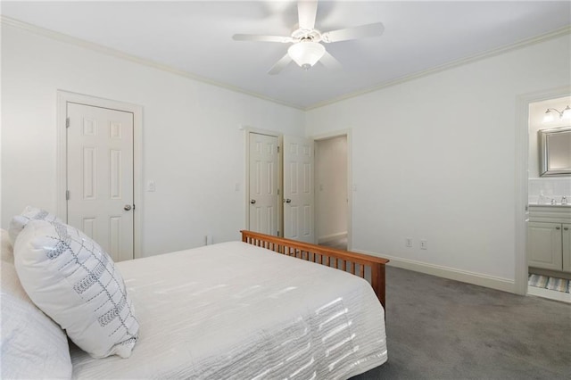 bedroom with carpet, baseboards, ensuite bath, ceiling fan, and crown molding