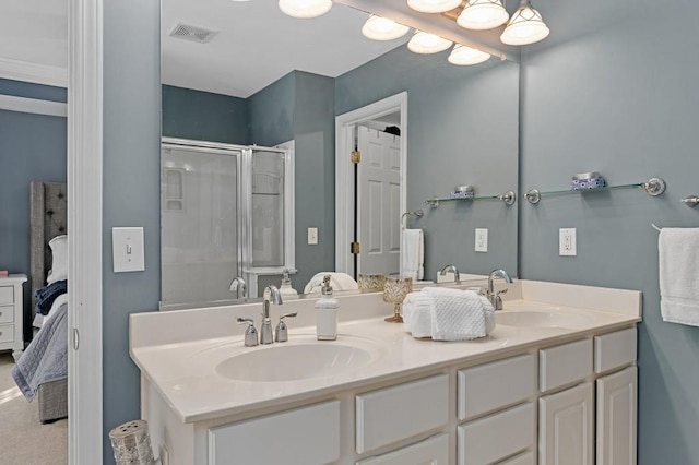 bathroom featuring vanity and a shower with shower door