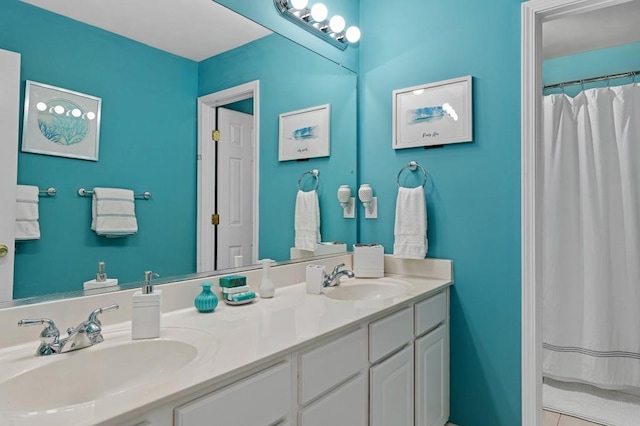 bathroom featuring vanity, tile patterned floors, and walk in shower