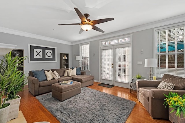 living room with wood-type flooring, a wealth of natural light, and french doors