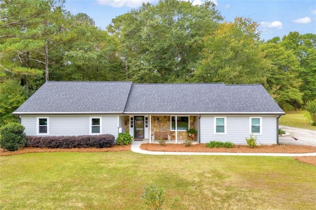 single story home featuring a porch and a front yard