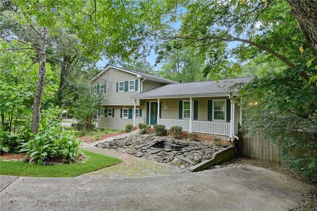 split level home featuring a porch