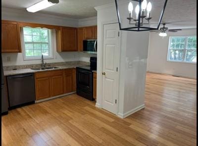 279 Fairview Dr, Dallas, GA 30157 - kitchen featuring black electric range oven, dishwashing machine, stainless steel microwave, a sink, and light wood finished floors