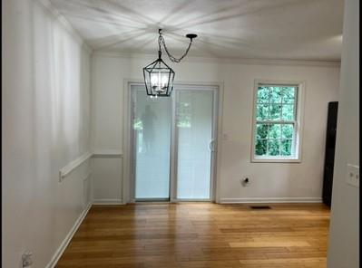 279 Fairview Dr, Dallas, GA 30157 - unfurnished dining area featuring a chandelier, wood finished floors, baseboards, and ornamental molding