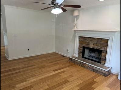 279 Fairview Dr, Dallas, GA 30157 - unfurnished living room featuring wood finished floors, a ceiling fan, a fireplace, ornamental molding, and baseboards