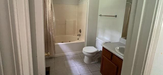 bathroom with tile patterned flooring, toilet, vanity, and shower / bath combo with shower curtain